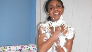 Whipped cream on her tanned skin, so delicious!