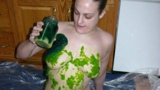 Green jelly and whipped cream on her body