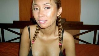 Asian beauty plays with her hairy pussy